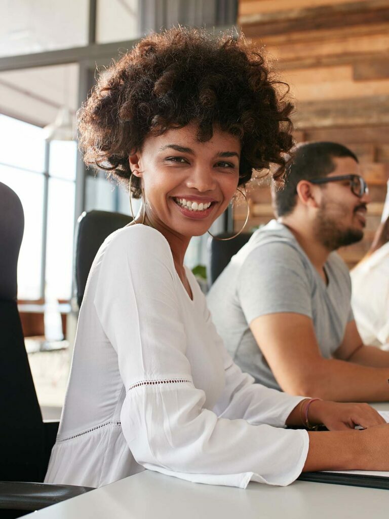 happy professional lady in a white blouse