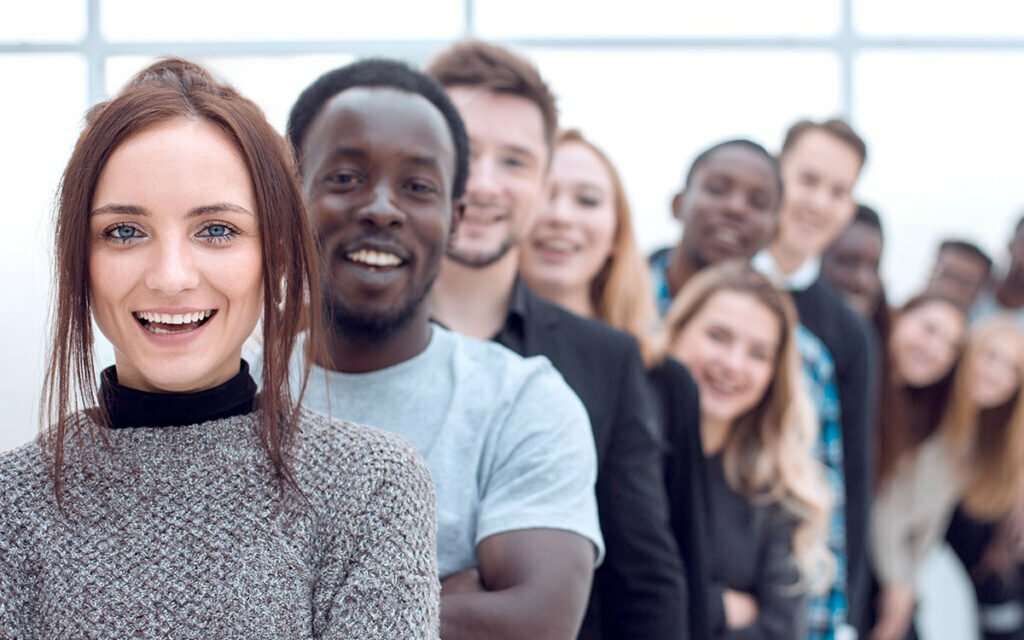 A happy line of people smiling for the camera