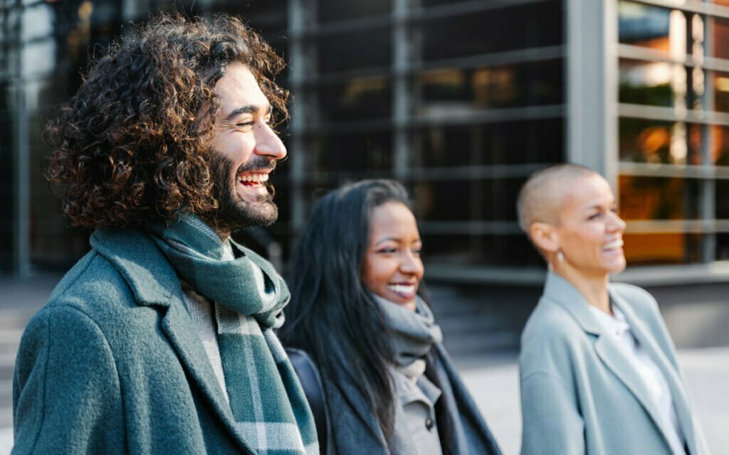 group of colleagues outside smiling